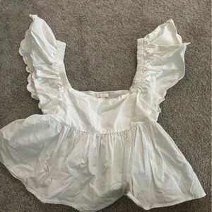 white top, puffy sleeves and puffy bottom half